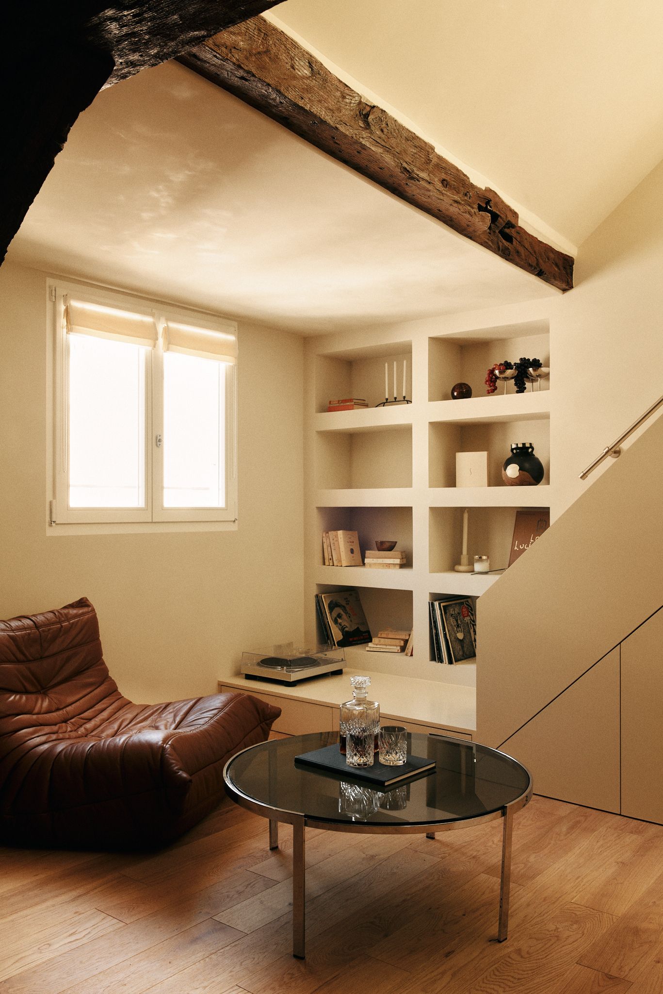 Image may contain Architecture Building Furniture Indoors Living Room Room Coffee Table Table and Interior Design