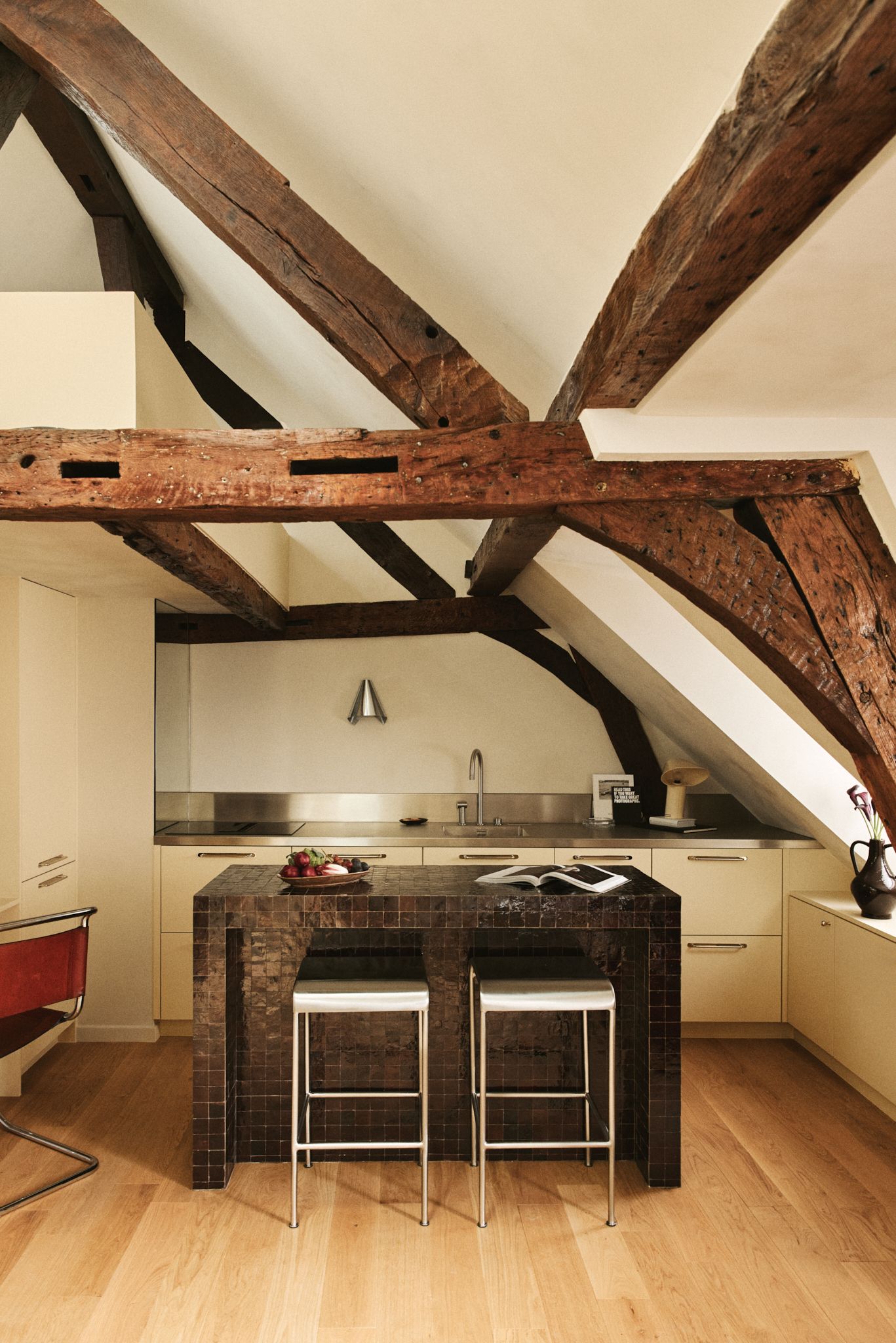 Image may contain Architecture Building House Housing Indoors Loft Room Wood Interior Design and Kitchen